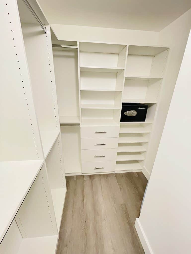 A white closet with shelves and drawers, ideal for kitchen remodeling.
